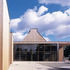 The entrance opens into a two-storey social and circulation space