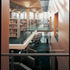 Main upper library with large openings into surrounding circulation, offices and specialist libraries