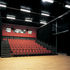 Small, multi-purpose auditorium with bleacher seating for 120