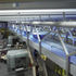 The elevated conveyor tracks run above the main space