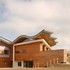 The limited external palette helps pull together the different facades