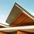 The roof is a defining feature of the building, flicking up at the end and undulating throughout