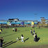 Southerly facades of school, to left , and health centre to right. In front of the building, to left, is the enclosed play area for the youngest children