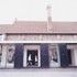 The glazed gallery rationalises circulation while leaving the historic structures exposed