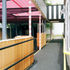 The steel joists zig-zag playfully as they support the pink GRP and its black-and-white bargeboards