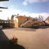 Northerly, playground side with stairs from gallery. The nearest, largely windowless ground floor space is the music room