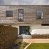 External finishes include ironstones in gabion cages, sweet chestnut cladding and a slate plinth