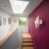 Stair treads cantilever from the double-height end wall