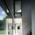 The view from the entrance hall towards the living area, showing the Juliet balcony to the master bedroom.