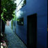 The rear of the terrace, the end houses clad in polycarbonate