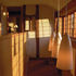 Small panes of handmade glass provide dappled light when the sun shines
