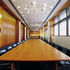 Fifth floor interconnected meeting rooms with original light fittings and timbers carefully restored – white marks new work