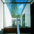 Approaching the head of he stair with its glazed balustrade, skylight and wall onto winter garden