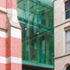 The lower level of the bridge, imperceptibly joining buildings at different levels