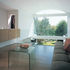 Lounge area stacked above kitchen, its floor curtailed each end to increase flow of light through the volume