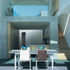 From the outdoor terrace the space flows through the dining area into the kitchen. Multiple openings let in shafts of light