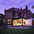 The garden at dusk, the extension reflects the unusual geometry of the house