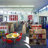 Room for 3-5 with calm colour palette, organised to provide educational structure. Courtyard to right