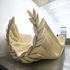 Sculptural piece made from 400 sheets of plywood, forms the reception desk, seating area and signage 