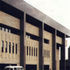 West elevation. A ramp leads down to the security moat and police vehicle area