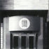 The entrance is lost among the emphatic structure and sobriety of the finishes