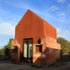 The studio inhabits a ruin and expresses the internal volume of the existing Victorian structure as a Cor-ten steel 