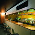 The middle rooms have off-white servery-style bars which plug the back wall