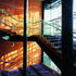 Patterned glass throws dappled light onto the stairs