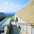 The southern entrance to the site is marked by a bold stand-alone structure