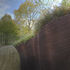The organic form embraces a five ton boulder on the site and is located at the furthest corner of the garden, providing a point of interest for garden visitors
