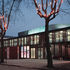 The exterior is an elegant mix of glazing, timber slatting and coloured light panels