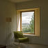 At the lower level the ceilings and internal face of the external walls are faced in lime render with timber lined window seats created in the deep reveals