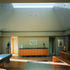 The dramatic first-floor living room, with its imposing cover ceiling, is at the heart of the artists house