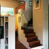 Stair in living room with mezzanine balcony beyond