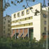 The administration block with its Corbusian overtures, is at back side of site