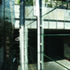 Inside a winter garden looking along the front of the building toward the railway viaduct