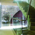 The communal stair cantilevering out toward the railway arches