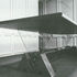 The boardroom table composed of elements which banded together form the TV-am logo