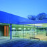 The roof spans a cut through the building, overlooked by the glazed café area