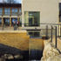 The waterfall by the cubic stone-clad reception block - the language of water and boulders is repeated at various points around the site