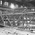 The galleries are hung from the steel trusses