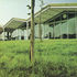 The school sits in its field like a luminous, five-gabled farm building