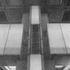 Ducting integrated visually with columns echoing the cruciform column plan on the lower level