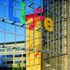 An open metal screen marks the entrance to the square