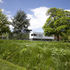 The pavilion sits within the wider park landscape