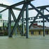 A floor-high steel truss supports the concrete floor