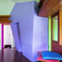 A purple sculptural form marks the entrance to the foodstore at the corner of the kitchen