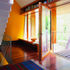The front door and the living room door form an east-west axis.   The master bedroom is to the right of the hall, the kitchen is to the left