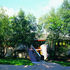 To the east the house is a discreet presence partially screened by trees.  This is in stark contrast to the open aspect to the west