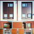 Timber panels are combined with red and blue brick, white render and steel roof coverings 